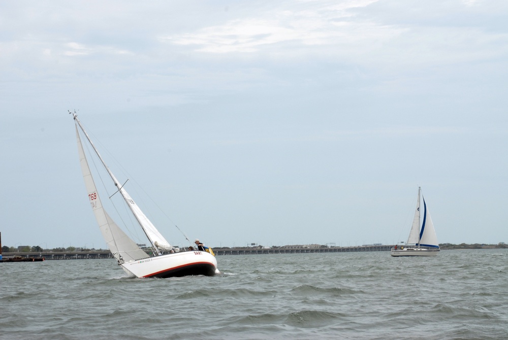 Sailors race sailboats off Norfolk