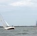 Sailors race sailboats off Norfolk