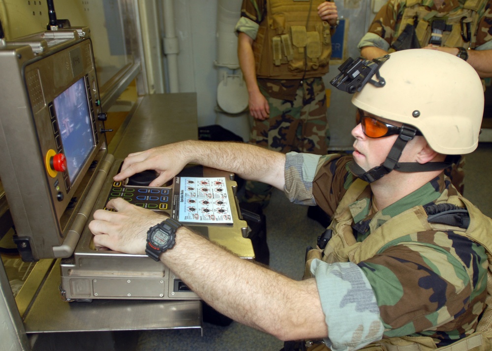 Navy bomb technicians practice bomb disposal techniques aboard USS Theodore Roosevelt