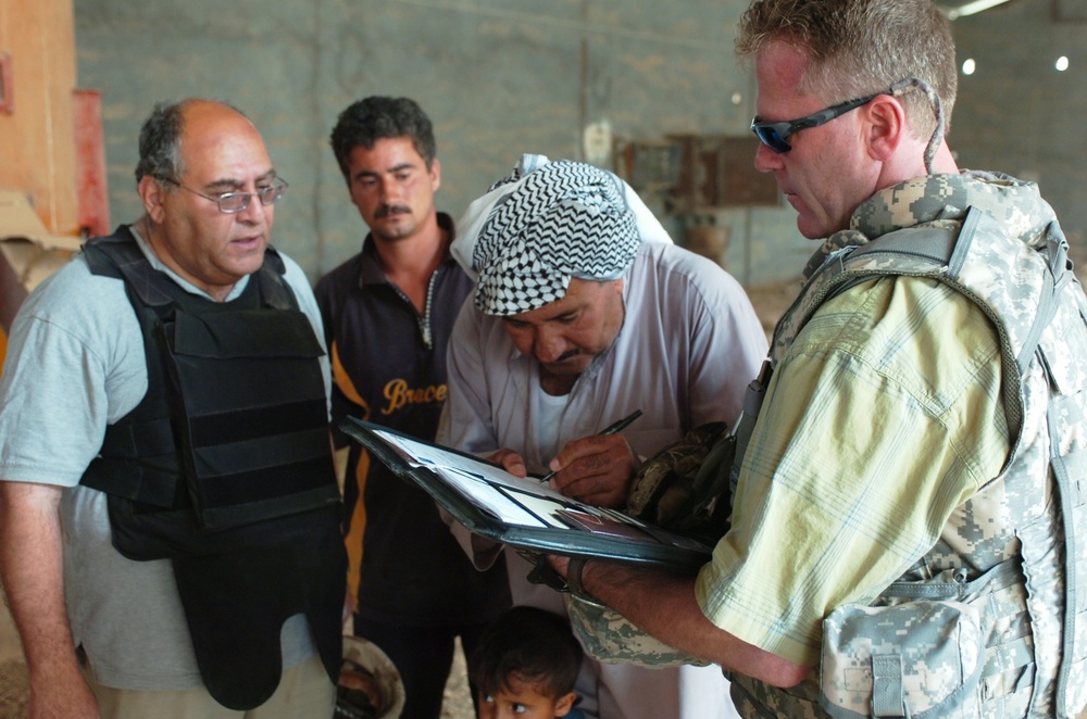 State Department, Coalition Troops Help Owner of Iraqi Feed Mill