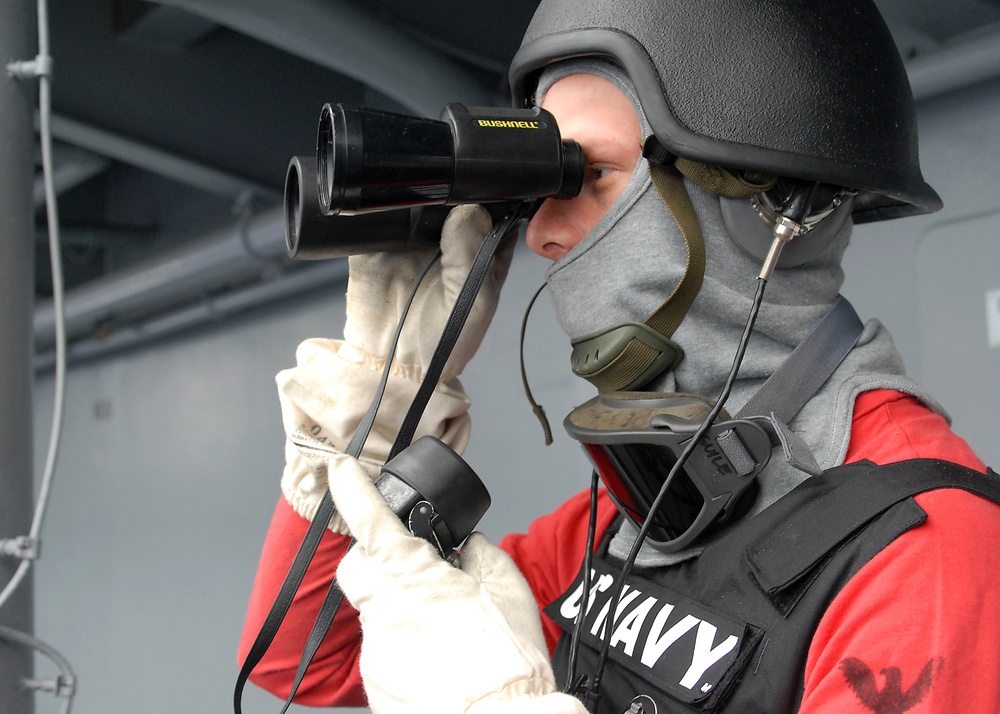 USS Peleliu Sailor keeps watch during general quarters drill