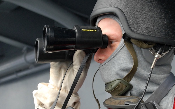 USS Peleliu Sailor keeps watch during general quarters drill
