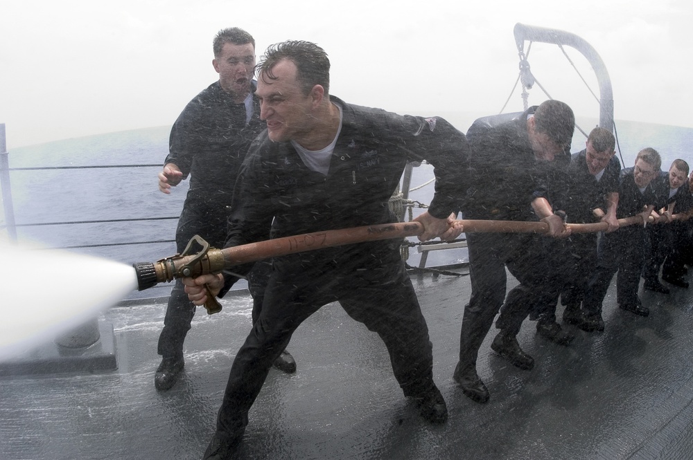 Fire hose handling training on USS Lassen