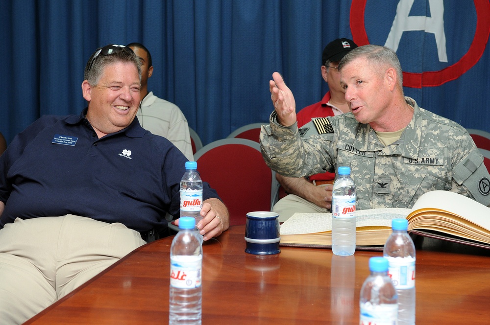 College football coaches visit fans in Qatar