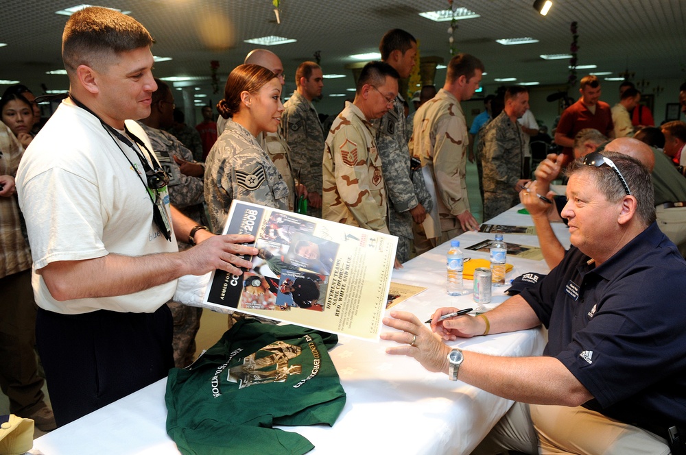 College football coaches visit fans in Qatar