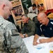 College football coaches visit fans in Qatar