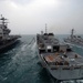 Carrier, destroyer conduct resupply mission while underway