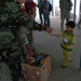 Iraqi army soldiers share tender moment with children in Jamilla