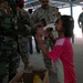 Iraqi army soldiers share tender moment with children in Jamilla