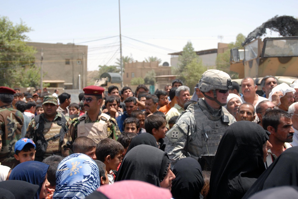 Baghdad Soldiers provide food, medical aid to help local residents
