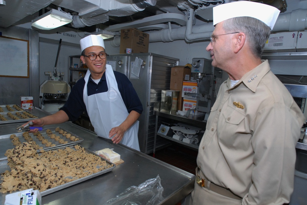 USS Blue Ridge Sailor meets with Navy official.