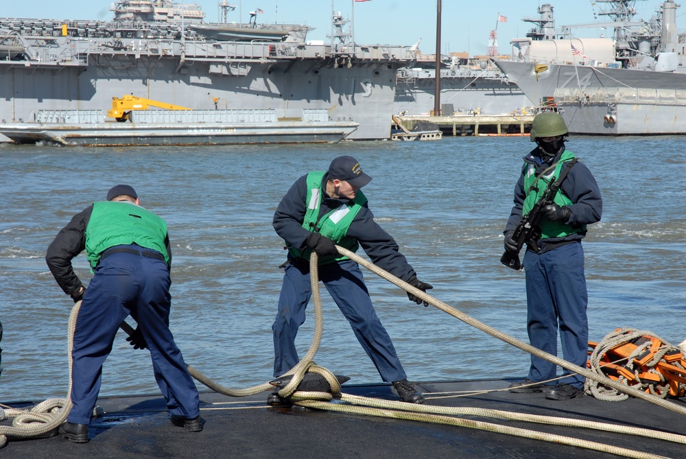 Tending to mooring lines at Naval Station Norfolk