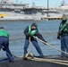 Tending to mooring lines at Naval Station Norfolk