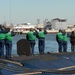 Tending to mooring lines at Naval Station Norfolk