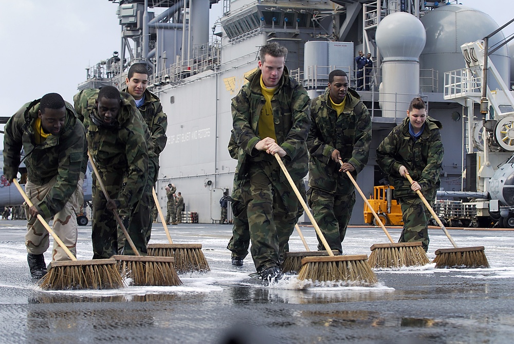 Scrubbing the flight deck aboard the USS Essex