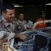 Iraqi Soldier Performs Maintenance on Vehicle