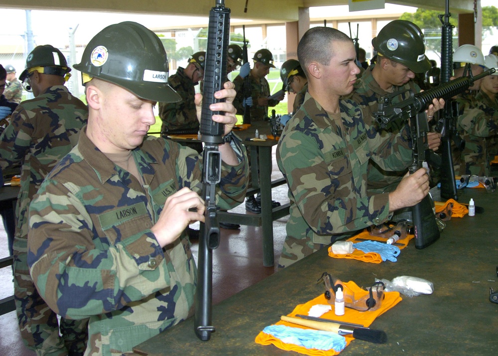 Seabees clean weapons on Okinawa