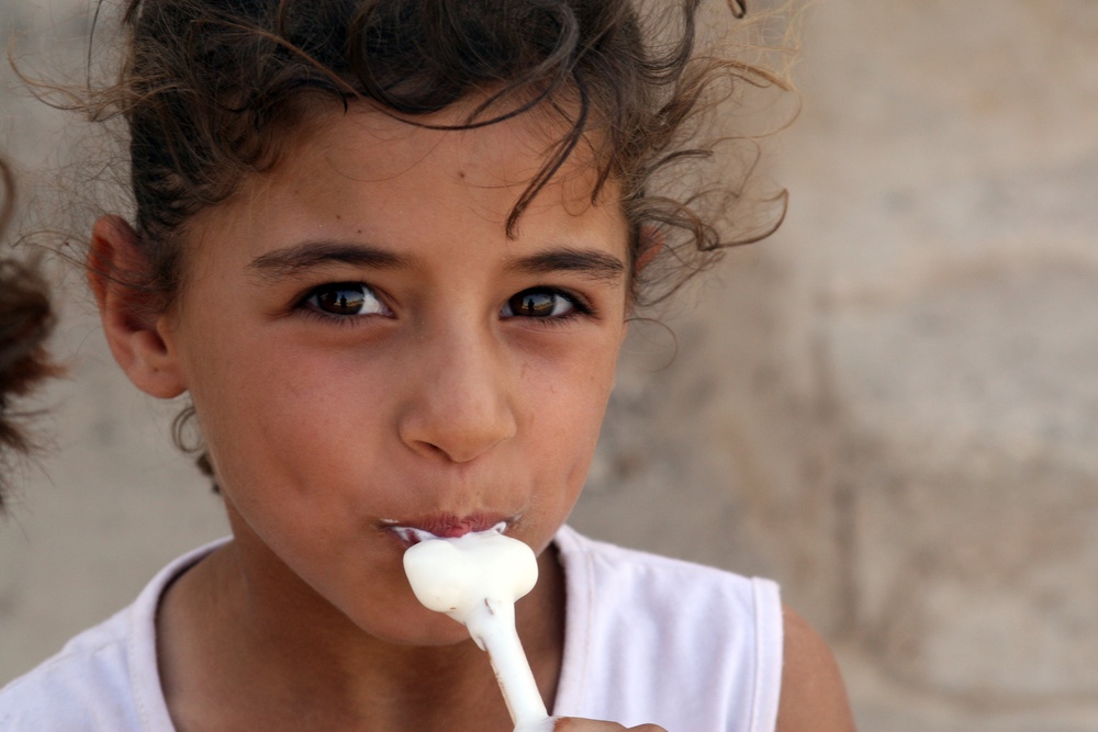 Iraqi Child Watches U.S. Marines