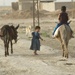 Iraqi Girl Walks Her Donkey
