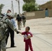 Soldiers, Iraqi Police Provide Pens, Smiles to Local Children
