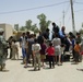 Soldiers, Iraqi Police Provide Pens, Smiles to Local Children
