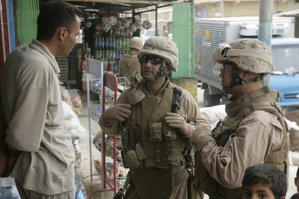 Talking with shop owners in Karma