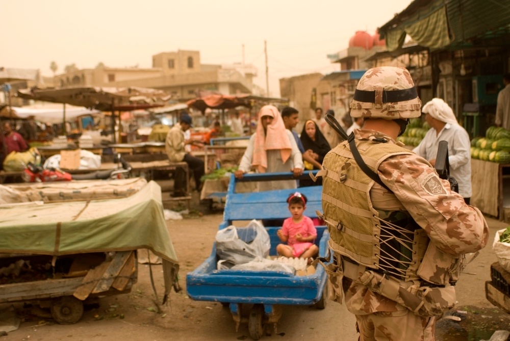 Civil Affairs Soldiers speak with Kut shopkeepers