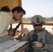 Gimlet leader teaches SoI how to maintain weapons
