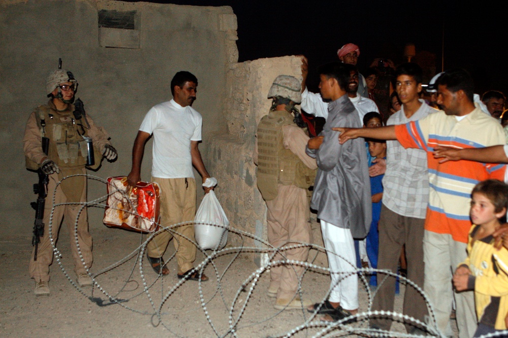 Marines assist local tribes in distributing goods