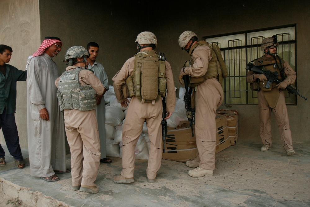 Marines assist local tribes in distributing goods