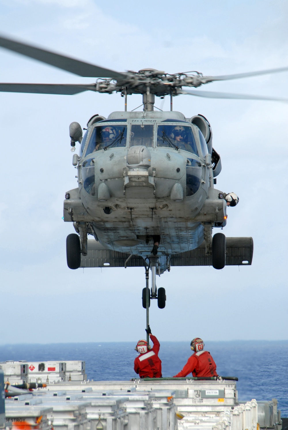 USS Nimitz offloads munitions while underway