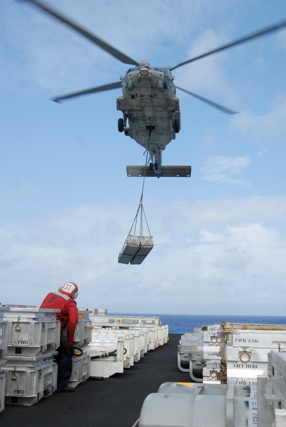 USS Nimitz offloads munitions while underway