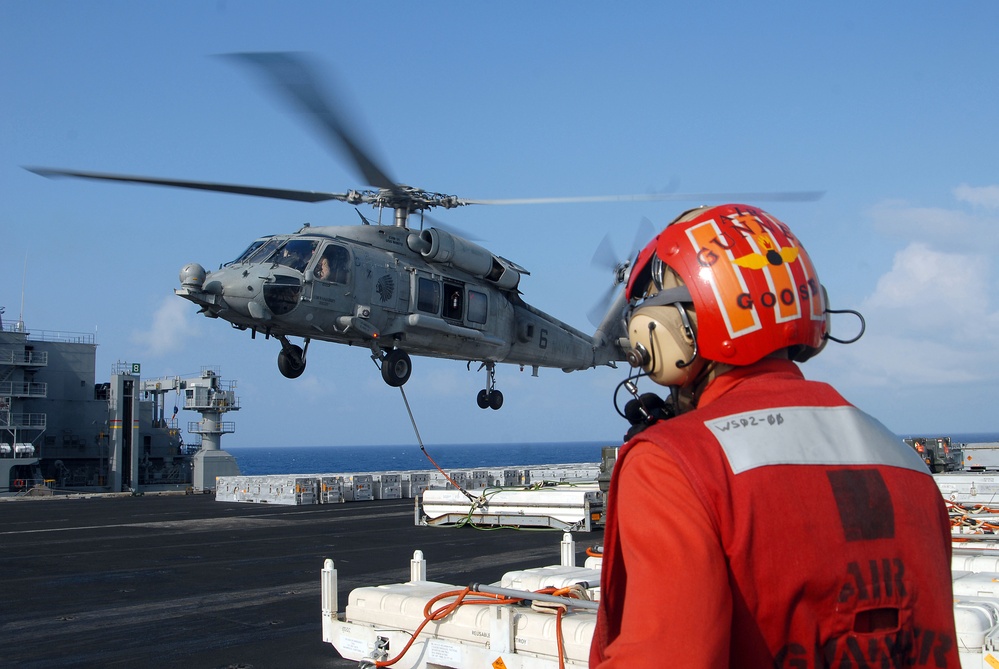 USS Nimitz offloads munitions while underway