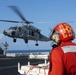 USS Nimitz offloads munitions while underway