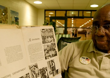 Navy veteran shows off cruise book