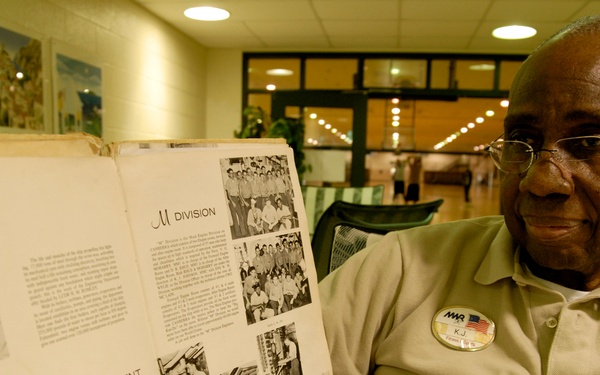 Navy veteran shows off cruise book