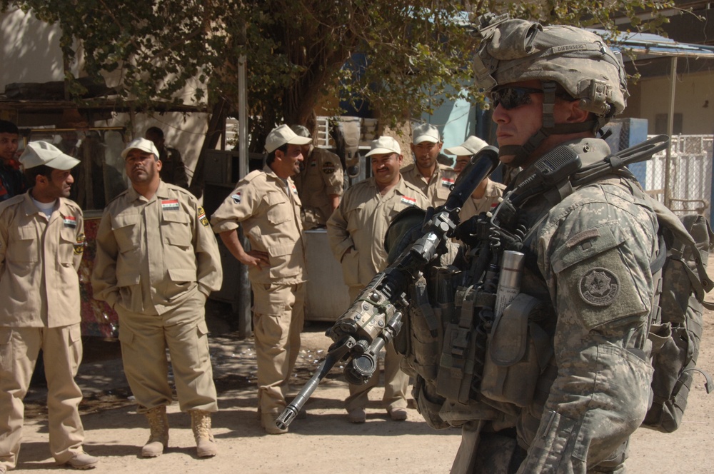 U.S., Iraqi forces patrol Rashid district