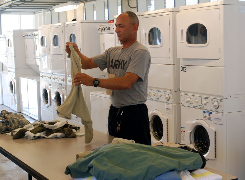 Joint Task Force Guantanamo Trooper Cleans Clothes