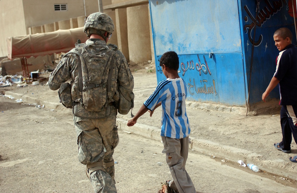 Regulars conduct foot patrol through Thawra 2
