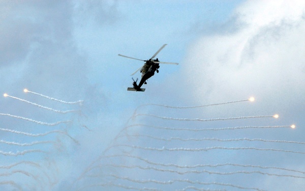 Outgoing squadron commander fires flares for change of command