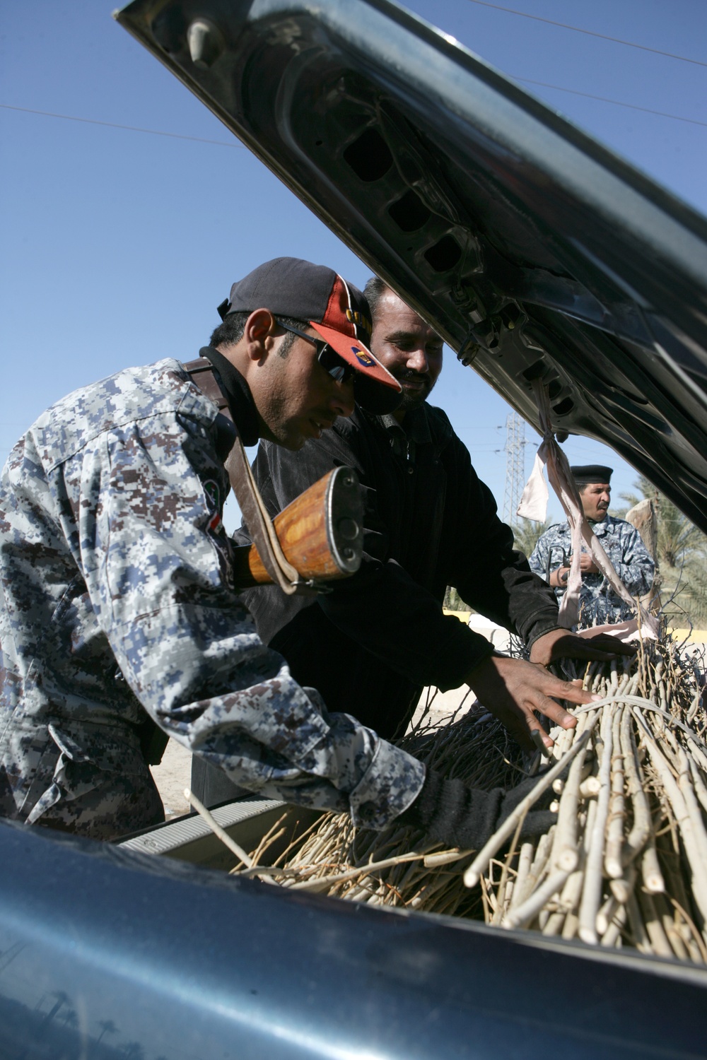 Checking and inspecting at entry control point in Fallujah