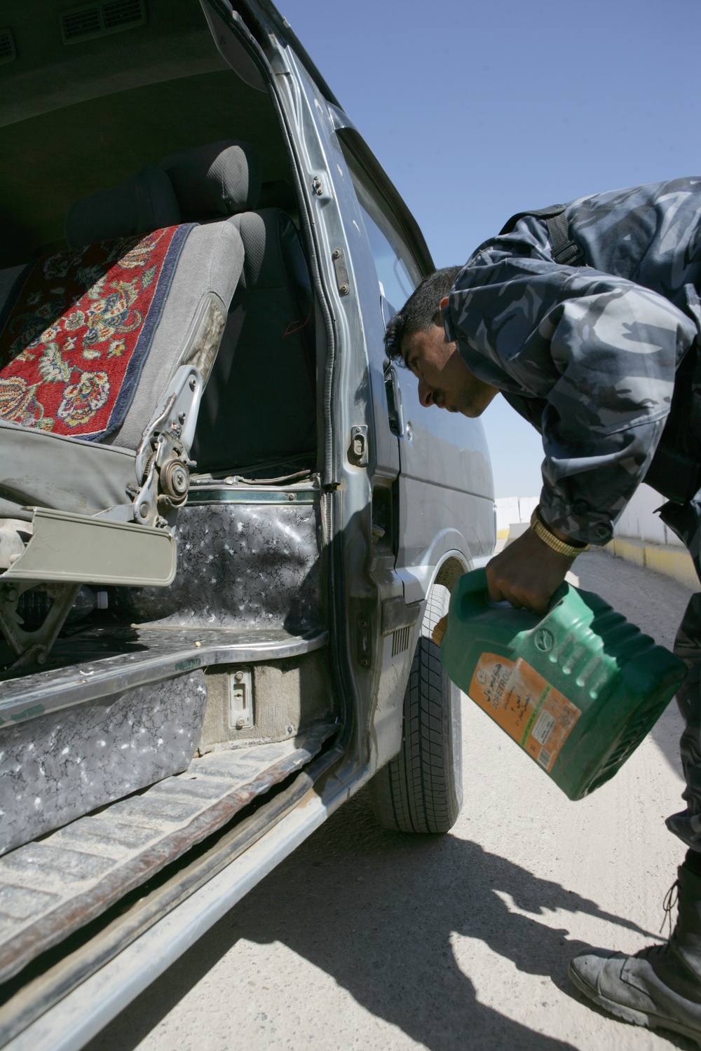 Checking and inspecting at entry control point in Fallujah