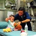 U.S. Australian service members take care of children in Pacific