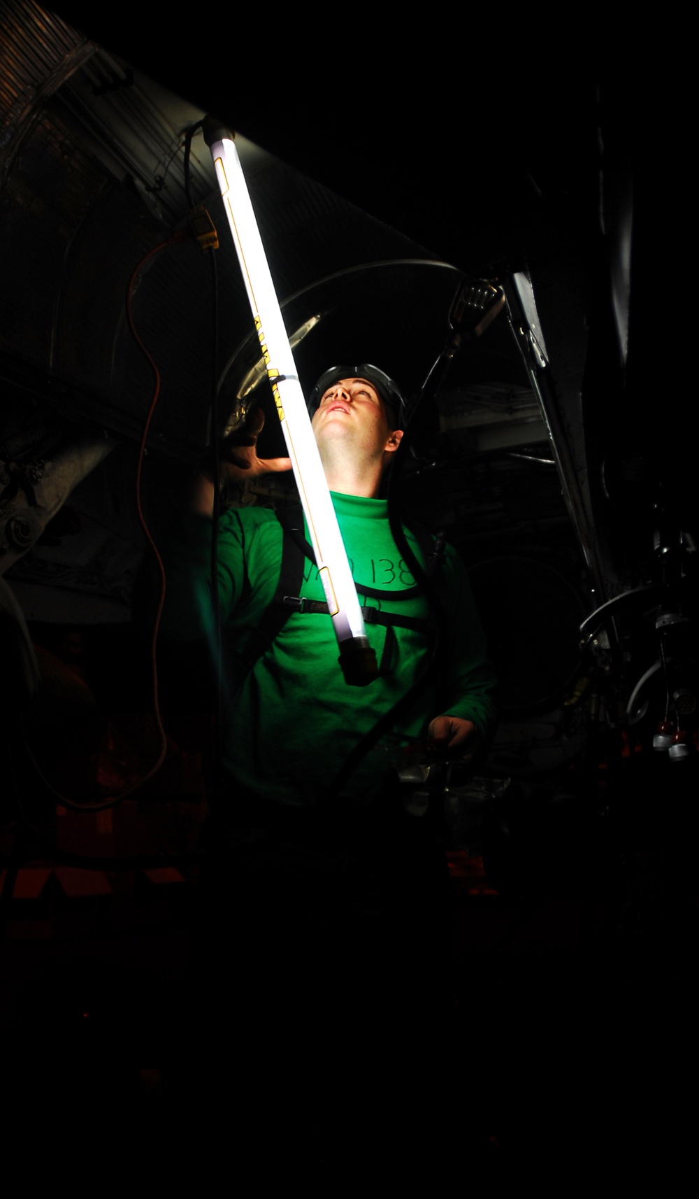 Sailor performs maintenance on a Prowler