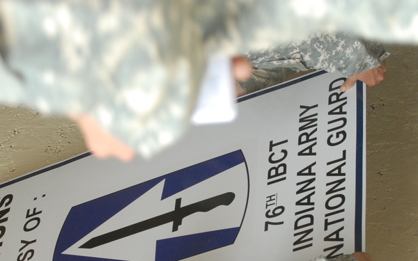 Soldier's, Iraqi's celebrate cooperation, open service station