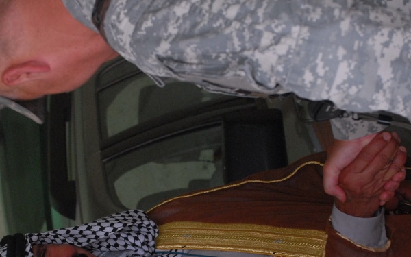 Soldier's, Iraqi's celebrate cooperation, open service station