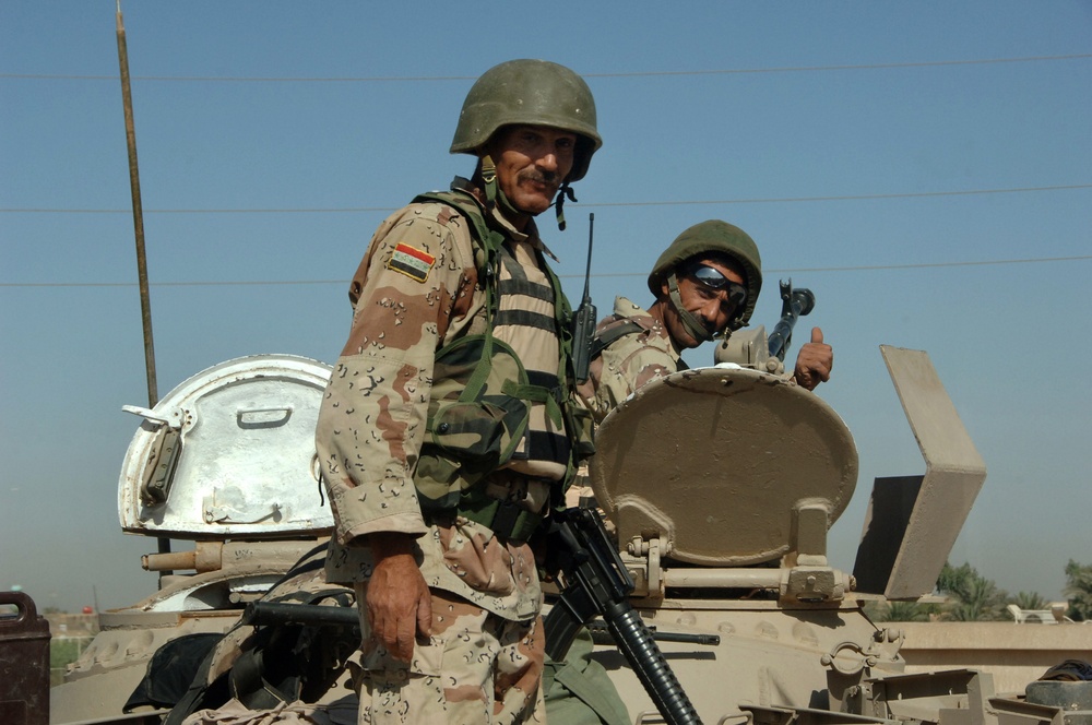 Iraq Soldiers Pose Atop Their Tank