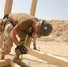 Seabees construct huts for Marine aide station