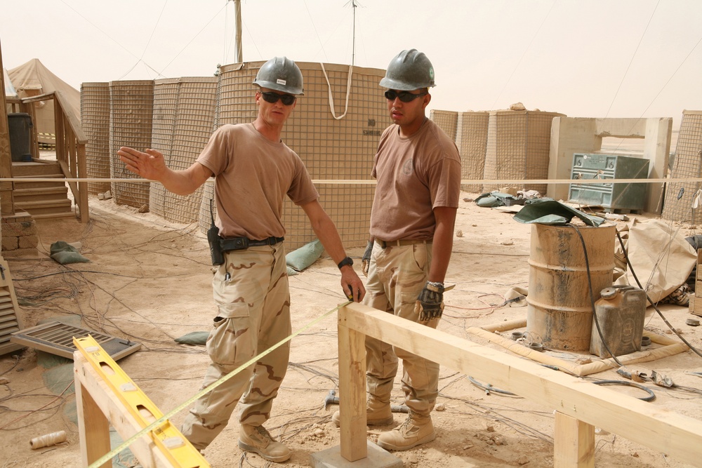 Seabees construct huts in Al Anbar province