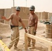 Seabees construct huts in Al Anbar province